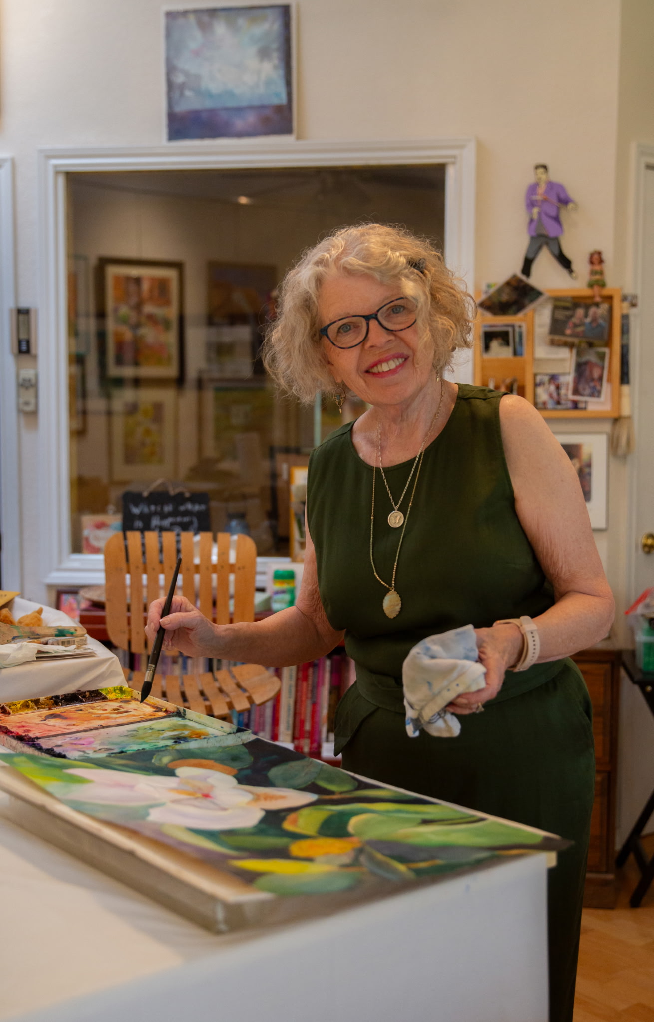 Jackie Haugen painting in her studio